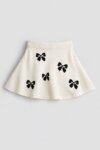 Jupe Évasée Fille en Tricot - Imprimé Nœuds Papillon (Blanc Écru ou Gris)