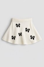 Jupe Évasée Fille en Tricot - Imprimé Nœuds Papillon (Blanc Écru ou Gris)